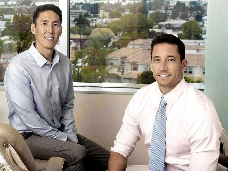 Dr. Charles Kim and Dr. Ryan Candelora in a treatment room at the practice.