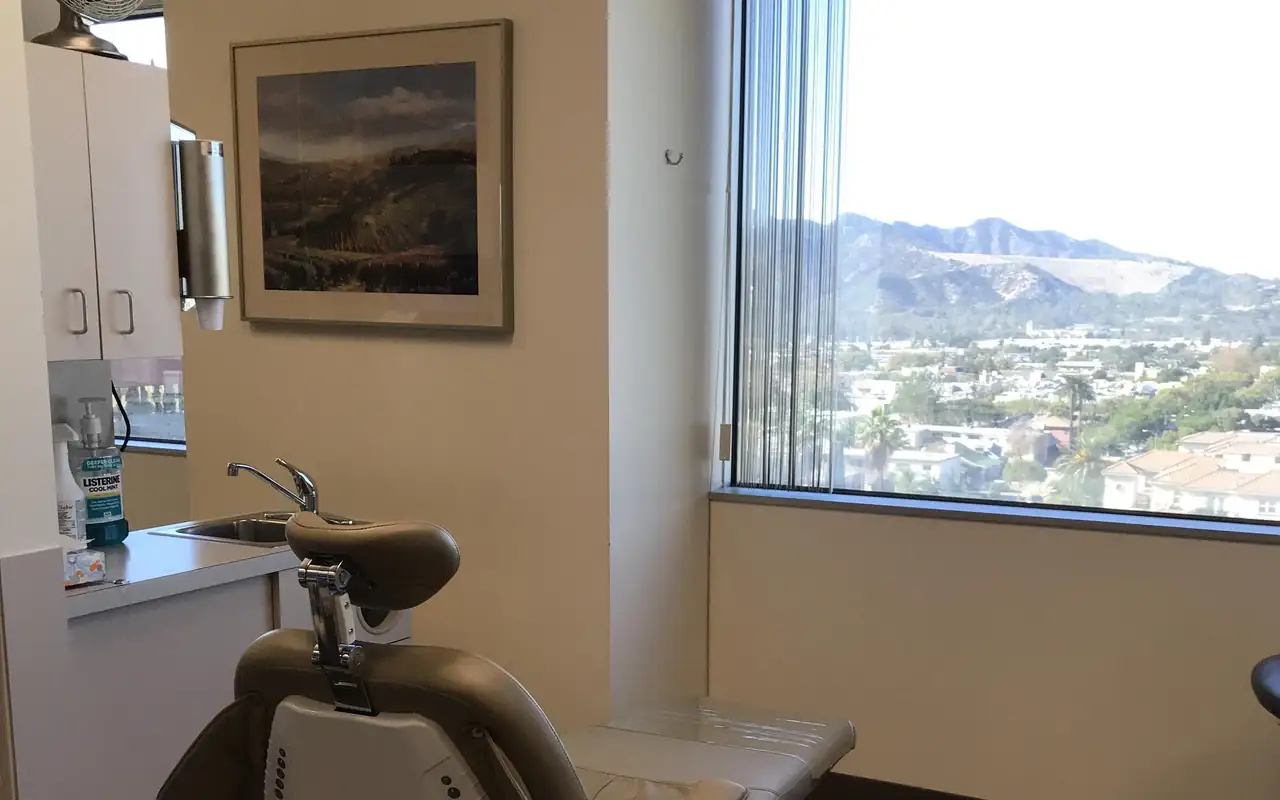 A treatment room at the practice on Central Avenue in Glendale, its window looking out over the city to the hills.